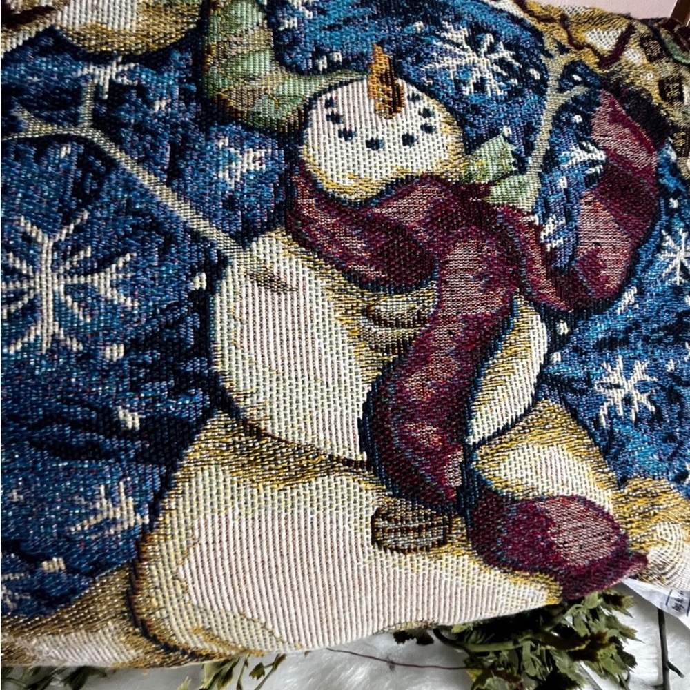 Tapestry Holiday pillow Snowman on one side berries on other side.